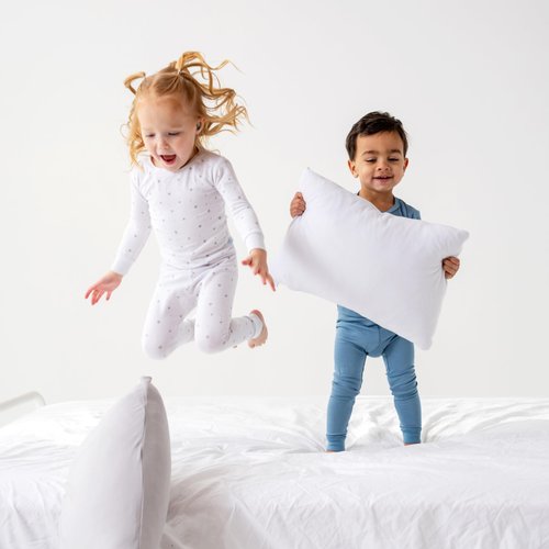 Dreamland Baby Premium Toddler Pillow and White Pillowcase, 13 x 18. Machine Washable, Ergonomic Kids Pillow + Ultra Soft Viscose Pillowcase. Mom-Owned US Business, Premium Materials